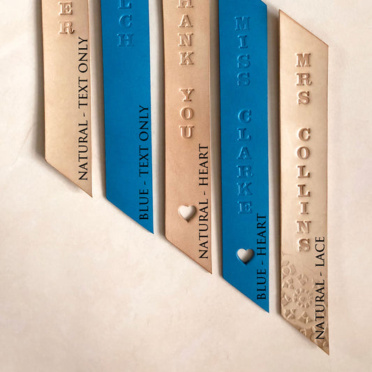 Handmade leather bookmark stamped with "DIOLCH"