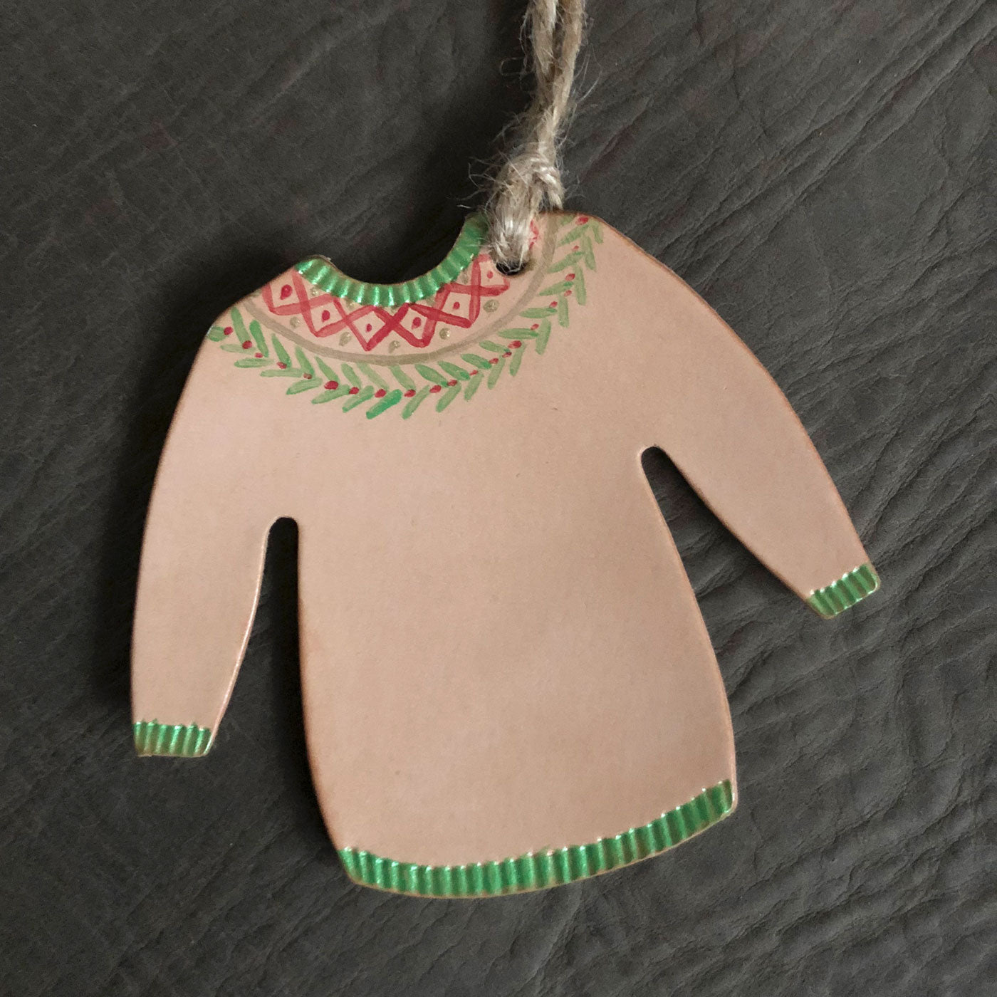 A Christmas jumper tree decoration painted in a festive design