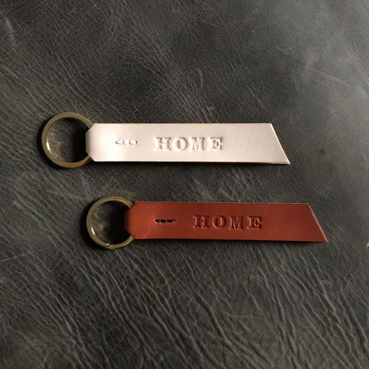 Handmade leather keyring stamped with "Home"